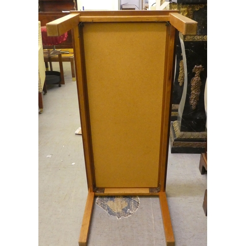 45 - A 1970s teak framed ten tile top coffee table, raised on square legs  17