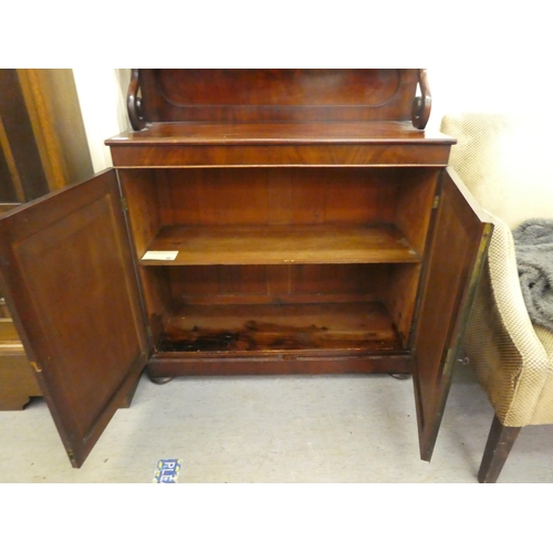 62 - An early Victorian mahogany chiffonier, the two tier superstructure with scrolled supports, over a p... 