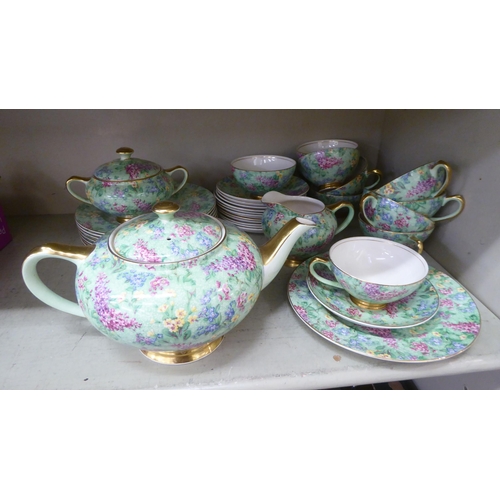 67 - British Empire Chintz china Lilac Time pattern teaware, comprising a teapot, saucer, milk jug, cups,... 