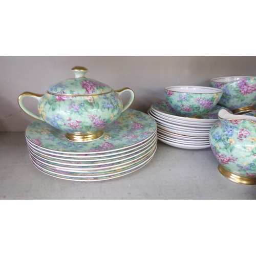 67 - British Empire Chintz china Lilac Time pattern teaware, comprising a teapot, saucer, milk jug, cups,... 