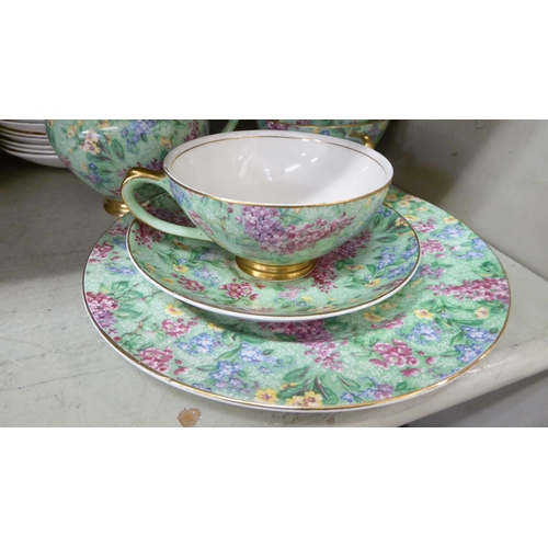 67 - British Empire Chintz china Lilac Time pattern teaware, comprising a teapot, saucer, milk jug, cups,... 