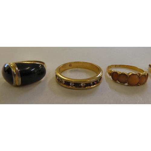 68 - Seven various gold coloured metal and other, variously set dress rings