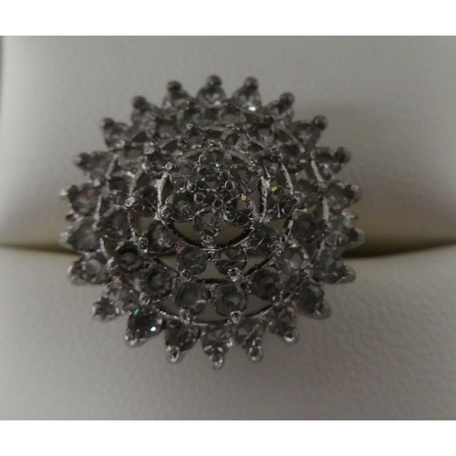 71 - A yellow metal dress ring, set with cubic zirconia