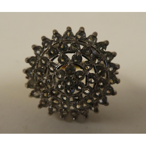 71 - A yellow metal dress ring, set with cubic zirconia