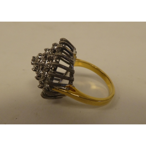 71 - A yellow metal dress ring, set with cubic zirconia