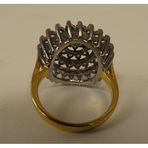 71 - A yellow metal dress ring, set with cubic zirconia