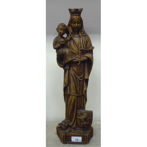 73 - A Continental faux carved wooden moulded, pottery figure 'Madonna and the Christ Child'  19