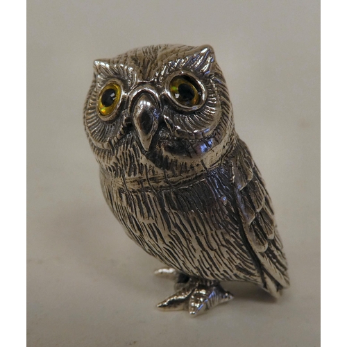 81 - A silver coloured metal miniature model owl  stamped Sterling