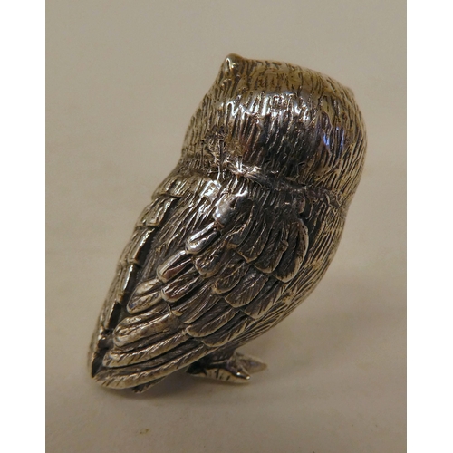 81 - A silver coloured metal miniature model owl  stamped Sterling