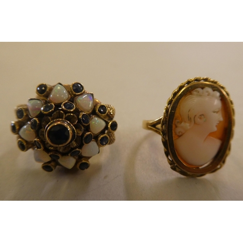 87 - An 18ct gold dress ring, set with opals and other stones; and an 18ct gold, oval cameo portrait ring