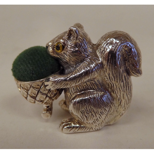 91 - A silver novelty pin cushion, fashioned as a squirrel  stamped Sterling