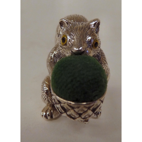 91 - A silver novelty pin cushion, fashioned as a squirrel  stamped Sterling