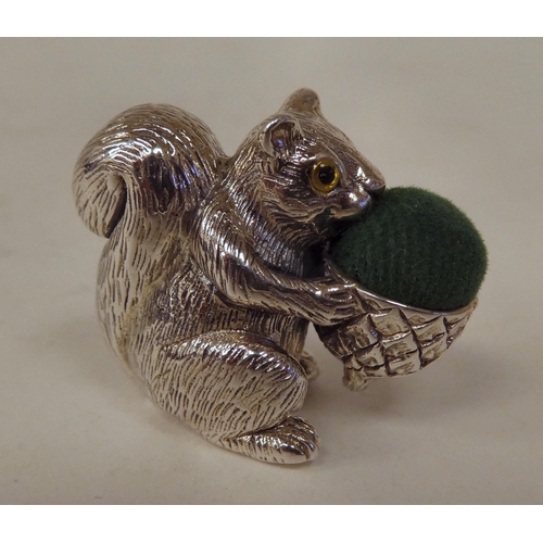 91 - A silver novelty pin cushion, fashioned as a squirrel  stamped Sterling