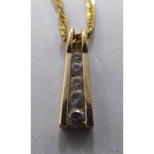 95 - A 9ct gold pendant necklace, set with white stones