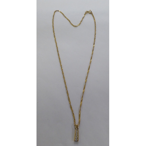 95 - A 9ct gold pendant necklace, set with white stones