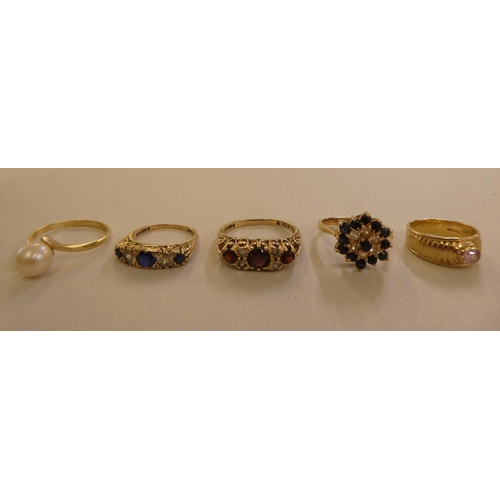 97 - Five 9ct gold rings, variously set with coloured stones