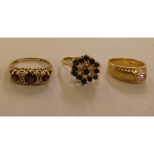 97 - Five 9ct gold rings, variously set with coloured stones