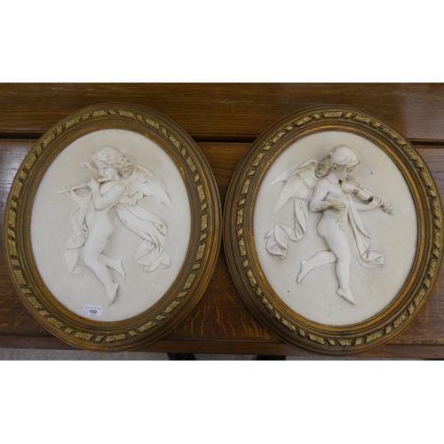 100 - Two modern composition plaques, decorated in relief with cherubic figures  16