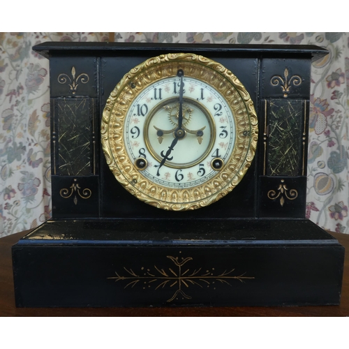 102 - An early/mid 20thC black painted metal cased mantel clock; the movement faced by an Arabic dial, on ... 