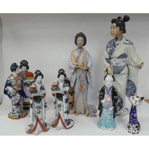 113 - Modern Oriental ceramics: to include figures wearing traditional robes  largest 19