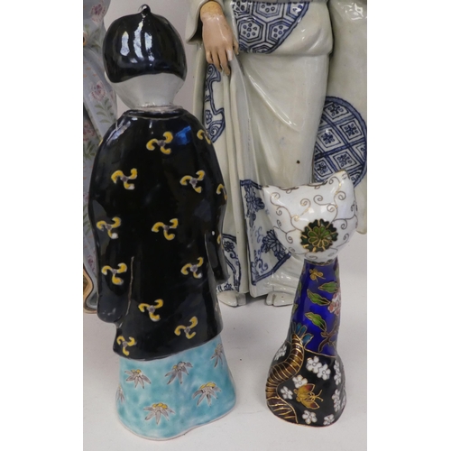 113 - Modern Oriental ceramics: to include figures wearing traditional robes  largest 19