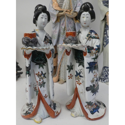 113 - Modern Oriental ceramics: to include figures wearing traditional robes  largest 19