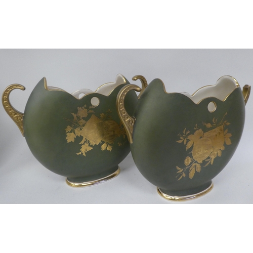 118 - Decorative ceramics: to include a pair of Sheffield pottery twin handled china vases, decorated with... 