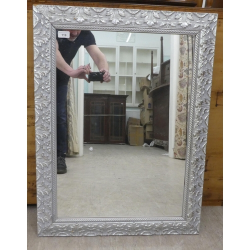 119 - A modern mirror, the plate set in a silvered effect frame  25