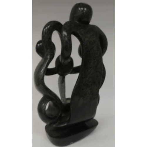 127 - A modern hardstone abstract sculpture, three figures with a pouring vessel  19