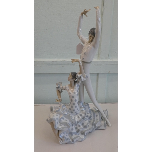 128 - Three Lladro porcelain figures, viz. two dancer  19