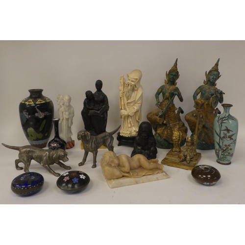 129 - 20thC Thai, European and other collectables: to include a pair of cast metal dancers  11