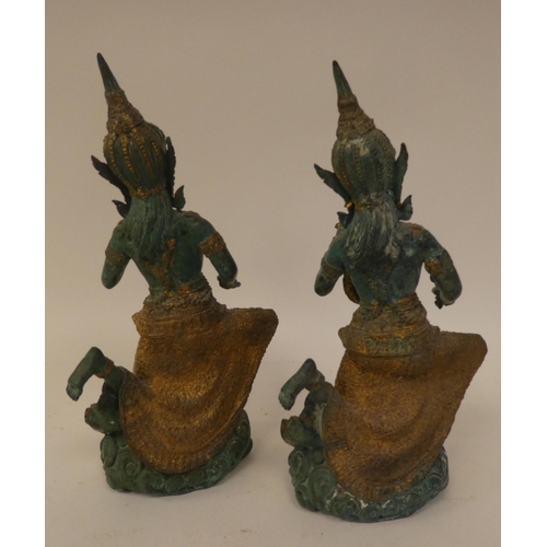 129 - 20thC Thai, European and other collectables: to include a pair of cast metal dancers  11