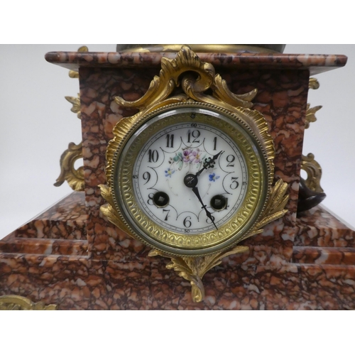 133 - A late 19thC French mantel clock, the mottled iron red marble case surmounted by a painted spelter g... 