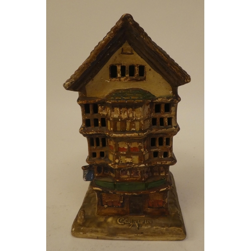 134 - A 1920s Cecil Aldin porcelain night light, fashioned as a Mediaeval townhouse  bears a moulded ... 