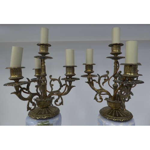 147 - A pair of 20thC decoratively cast brass and painted ovoid shape ceramic table lamps, each comprising... 