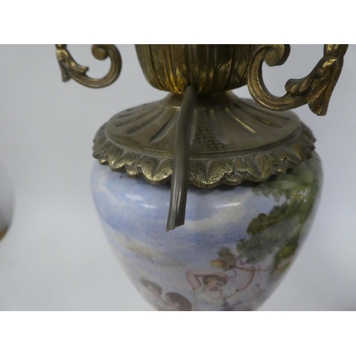 147 - A pair of 20thC decoratively cast brass and painted ovoid shape ceramic table lamps, each comprising... 