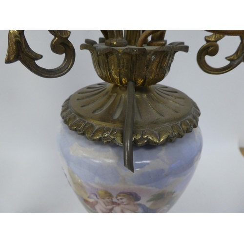 147 - A pair of 20thC decoratively cast brass and painted ovoid shape ceramic table lamps, each comprising... 