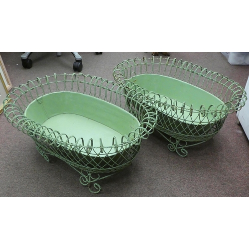 149 - A pair of vintage oval green wirework planters with tinplate liners, elevated on scrolled feet  26