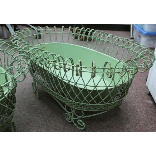 149 - A pair of vintage oval green wirework planters with tinplate liners, elevated on scrolled feet  26