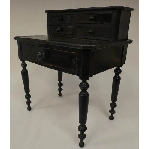 179 - A late 19thC ebonised pine apprentice piece, bonheur du jour with a drawer fitted superstructure, ra... 