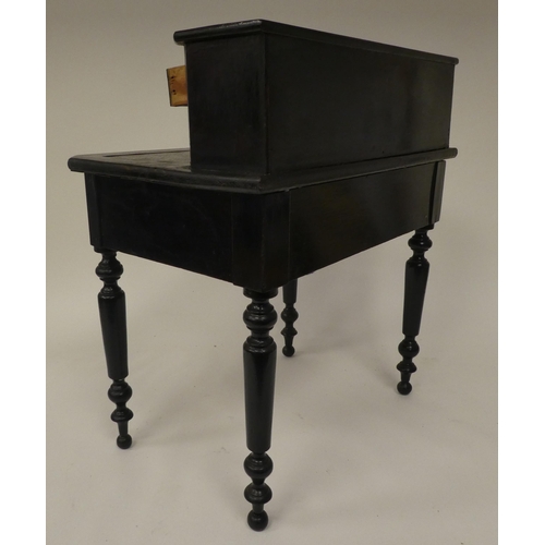 179 - A late 19thC ebonised pine apprentice piece, bonheur du jour with a drawer fitted superstructure, ra... 