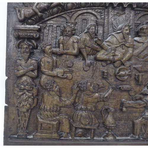 45 - A 19thC 'The Last Supper' oak wall panel, carved in high relief with an interior scene, figures seat... 