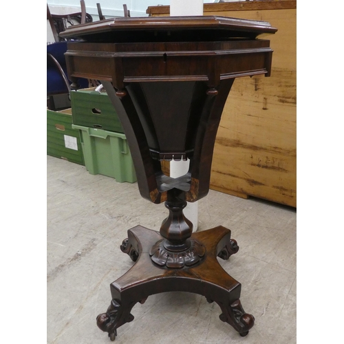 75 - A late Victorian rosewood veneered sewing table, the octagonal deep section raised on splayed suppor... 