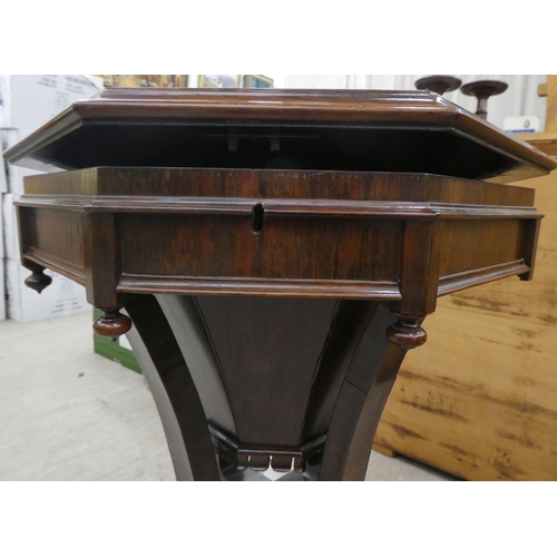 75 - A late Victorian rosewood veneered sewing table, the octagonal deep section raised on splayed suppor... 