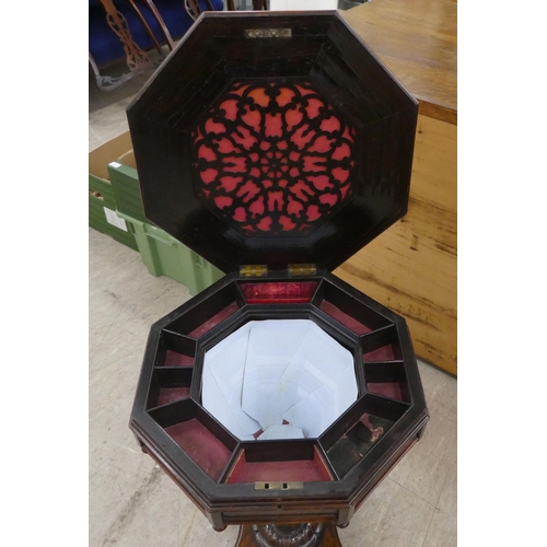 75 - A late Victorian rosewood veneered sewing table, the octagonal deep section raised on splayed suppor... 