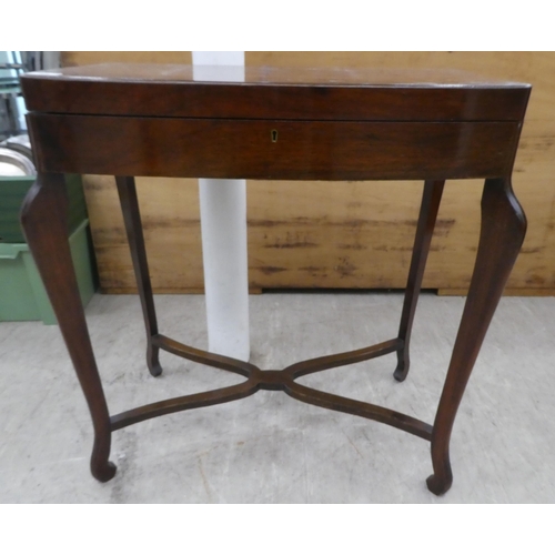 87 - A mid 20thC mahogany bow front canteen, raised on tapered legs  29