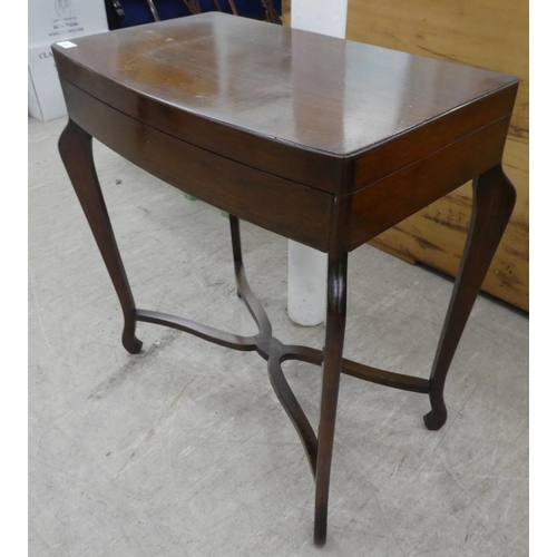 87 - A mid 20thC mahogany bow front canteen, raised on tapered legs  29