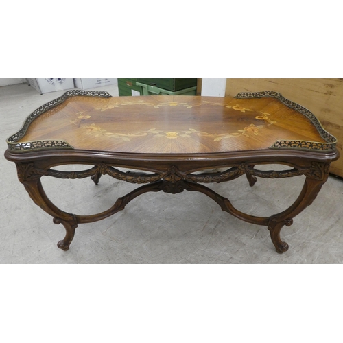 89 - A 20thC reproduction of a 19thC Italian inspired marquetry rosewood finished coffee table with a bra... 