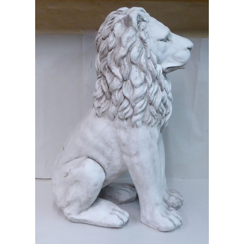 44 - A white painted moulded composition, seated heraldic lion  24