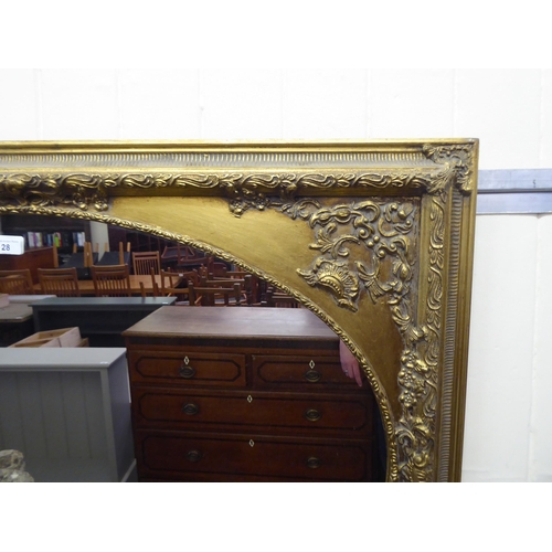 28 - A 20thC mirror, the oval plate set in an antique inspired, moulded gilt frame  30